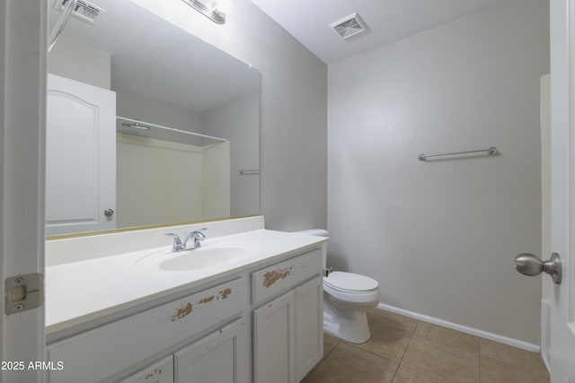 41388 W Hopper Dr, Maricopa, AZ 85138 - bathroom featuring toilet, baseboards, vanity, and tile patterned floors