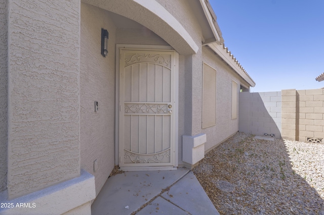 41388 W Hopper Dr, Maricopa, AZ 85138 - view of exterior entry with stucco siding and fence