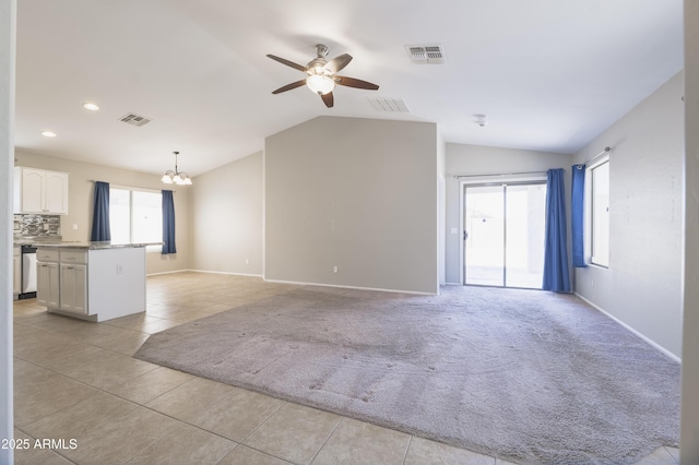 41388 W Hopper Dr, Maricopa, AZ 85138 - unfurnished living room with a chandelier, light tile patterned floors, lofted ceiling, a ceiling fan, and light colored carpet