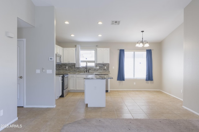 41388 W Hopper Dr, Maricopa, AZ 85138 - kitchen featuring appliances with stainless steel finishes, a sink, white cabinetry, a chandelier, and recessed lighting