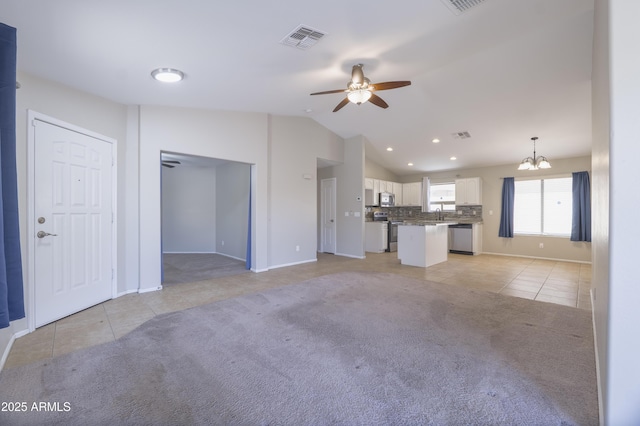 41388 W Hopper Dr, Maricopa, AZ 85138 - unfurnished living room featuring light tile patterned flooring, a ceiling fan, light colored carpet, lofted ceiling, and a chandelier