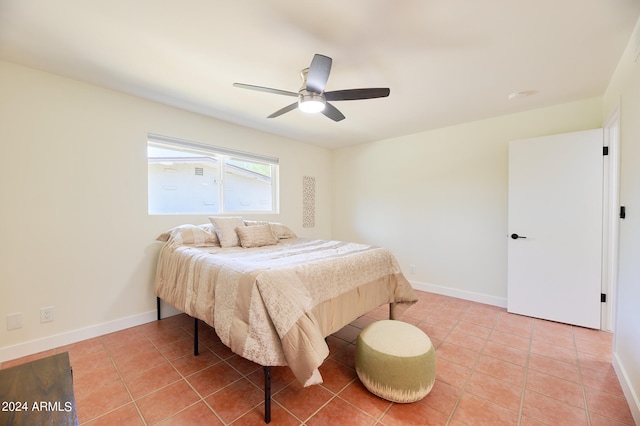 tiled bedroom with ceiling fan