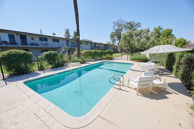 view of swimming pool featuring a patio area