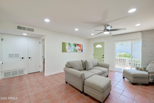 tiled living room featuring ceiling fan