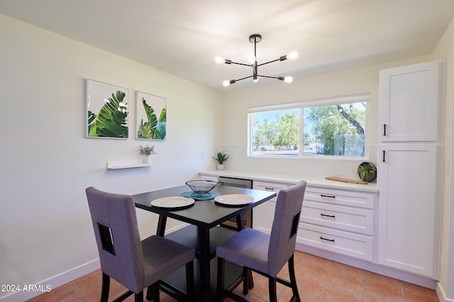 dining room featuring light tile patterned floors and a chandelier