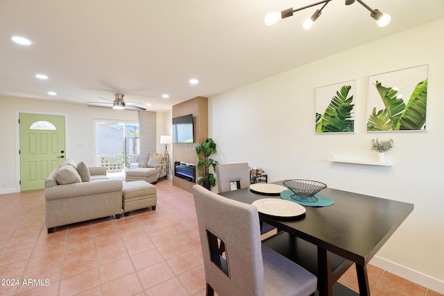 dining space featuring ceiling fan and light tile patterned floors