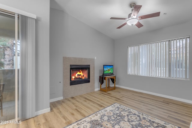 2929 W Yorkshire Dr Unit 2013, Phoenix, AZ 85027 - interior space featuring lofted ceiling, a tile fireplace, wood finished floors, and baseboards