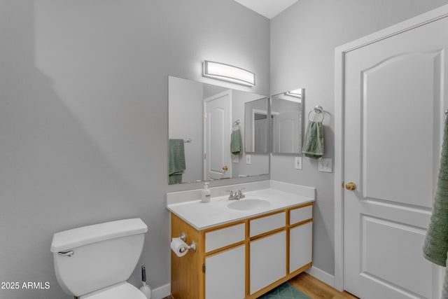 2929 W Yorkshire Dr Unit 2013, Phoenix, AZ 85027 - bathroom with wood finished floors, vanity, toilet, and baseboards
