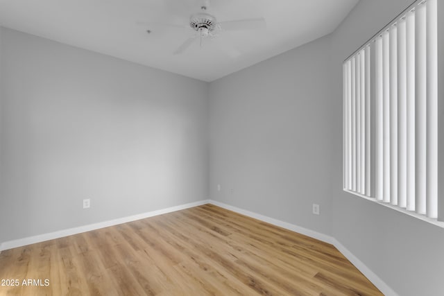 2929 W Yorkshire Dr Unit 2013, Phoenix, AZ 85027 - empty room with wood finished floors, a ceiling fan, and baseboards