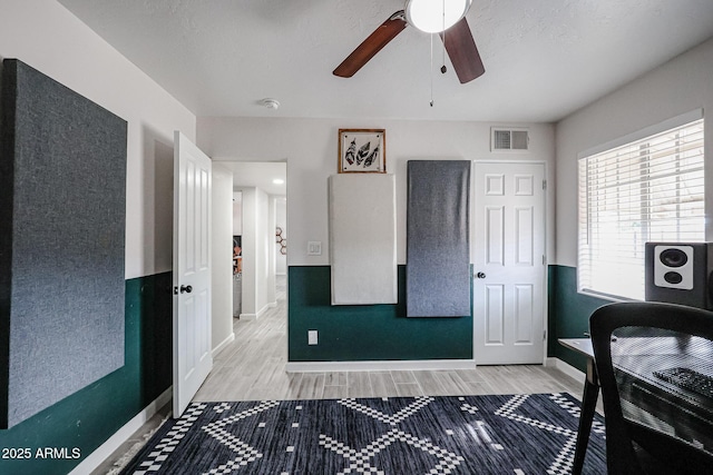 office featuring ceiling fan and hardwood / wood-style floors