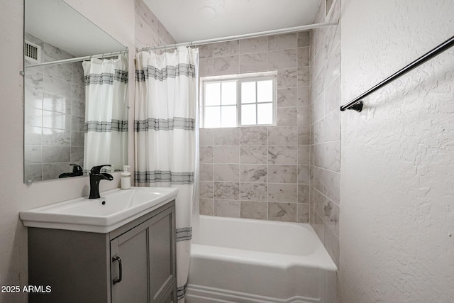 bathroom with vanity and shower / tub combo with curtain