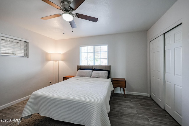 bedroom with ceiling fan and a closet