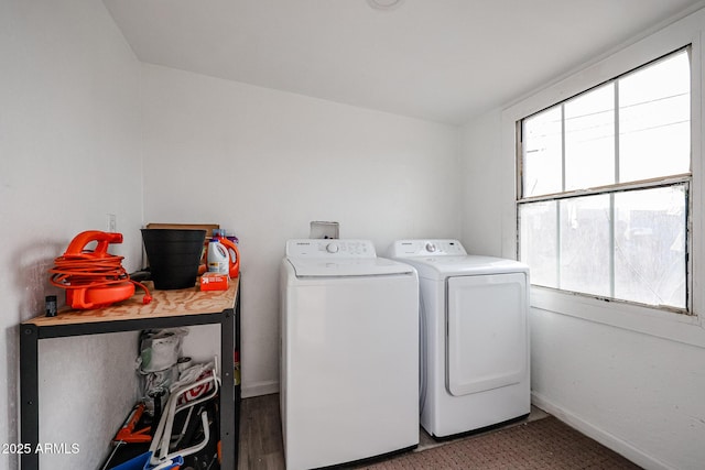 laundry room featuring a healthy amount of sunlight and independent washer and dryer