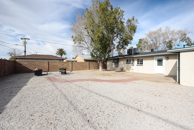 back of house with a patio