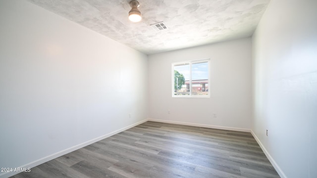 empty room featuring wood-type flooring