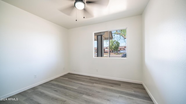 unfurnished room with ceiling fan and hardwood / wood-style floors