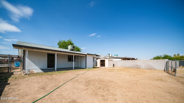 back of property with central air condition unit