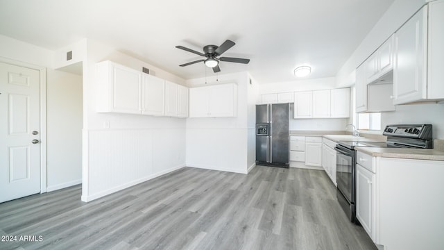 kitchen featuring sink, ceiling fan, white cabinetry, black appliances, and light wood-type flooring