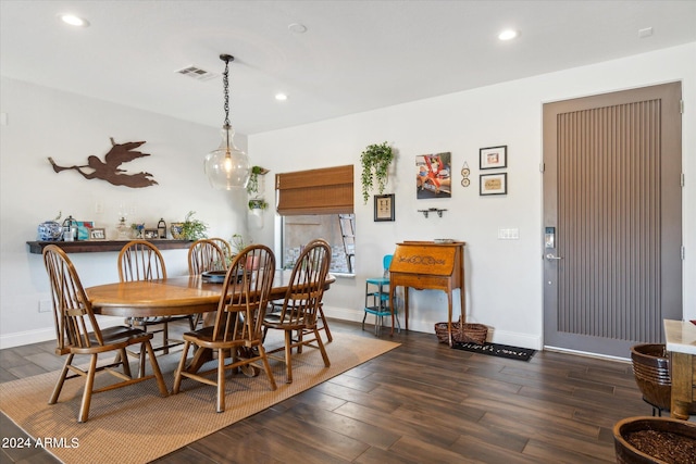 dining room with dark wood-type flooring