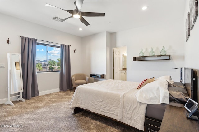 bedroom featuring connected bathroom, ceiling fan, and carpet flooring