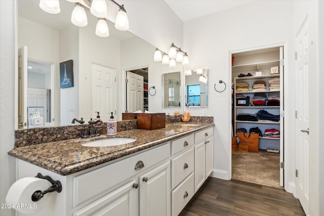 bathroom featuring vanity and hardwood / wood-style floors