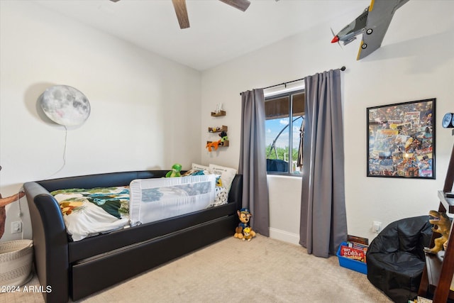 bedroom with ceiling fan and light colored carpet