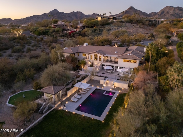 aerial view at dusk with a mountain view