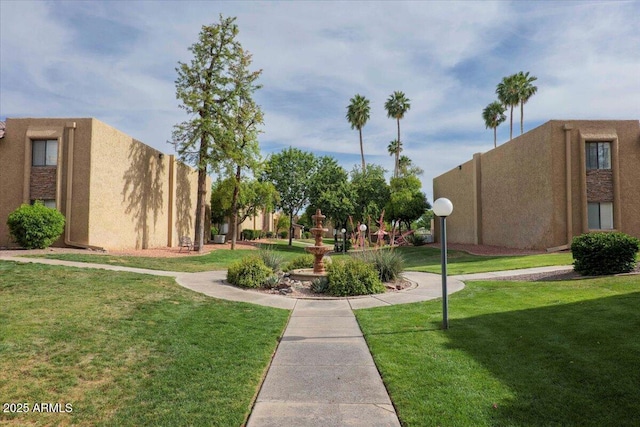 view of community featuring a yard