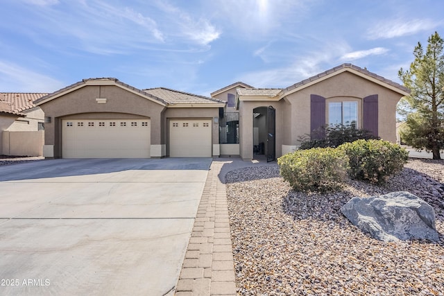 view of front of home with a garage