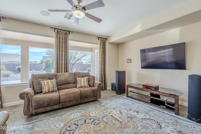 tiled living room with ceiling fan