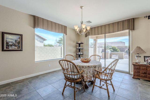 dining space featuring a chandelier