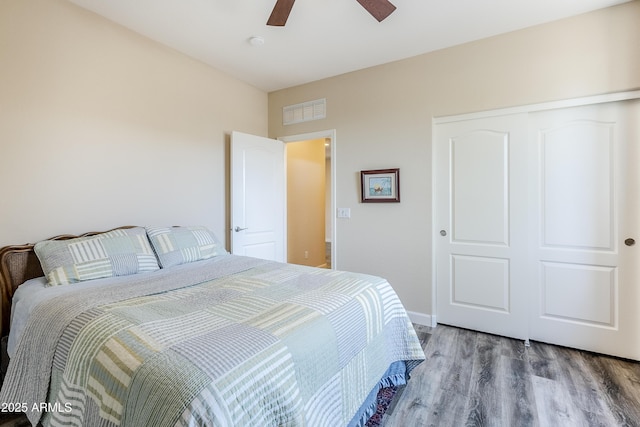 bedroom featuring wood-type flooring and ceiling fan