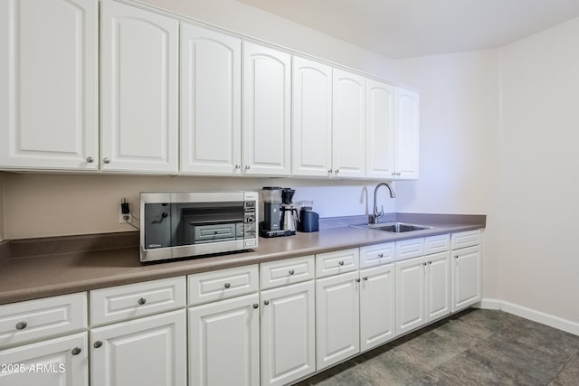 kitchen with sink and white cabinets