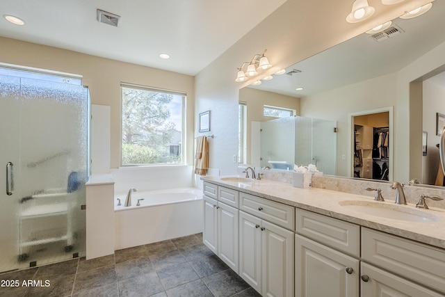 bathroom featuring vanity and plus walk in shower