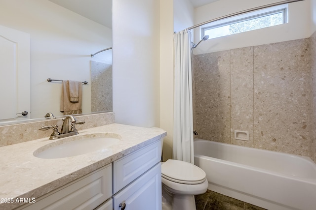 full bathroom with vanity, shower / tub combo, and toilet