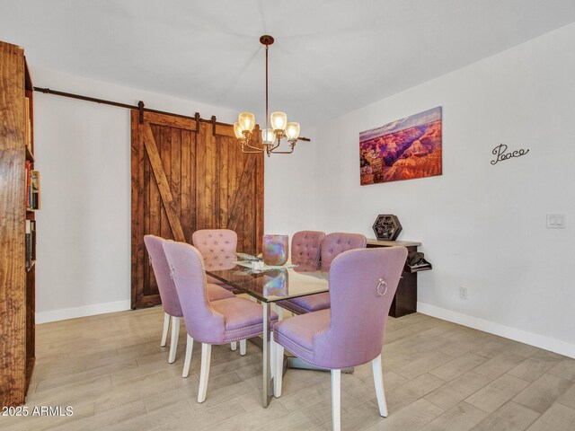 15817 S 177th Dr, Goodyear, AZ 85338 - dining space with light wood-style flooring, a chandelier, and baseboards