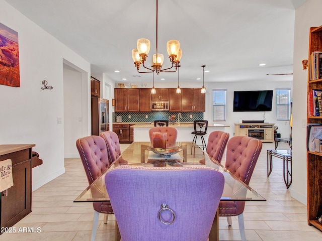 15817 S 177th Dr, Goodyear, AZ 85338 - dining space with a chandelier, recessed lighting, and baseboards