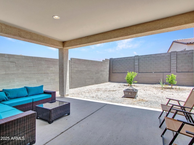 15817 S 177th Dr, Goodyear, AZ 85338 - fenced backyard with an outdoor living space with a fire pit and a patio