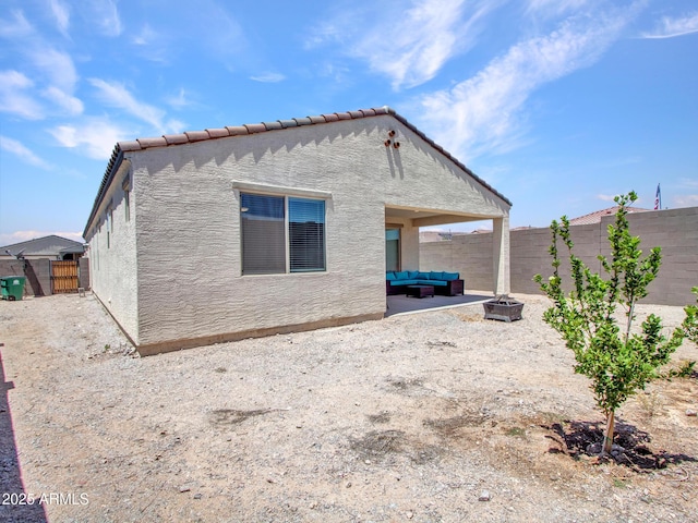 15817 S 177th Dr, Goodyear, AZ 85338 - back of house with outdoor lounge area, a fenced backyard, a patio area, and stucco siding