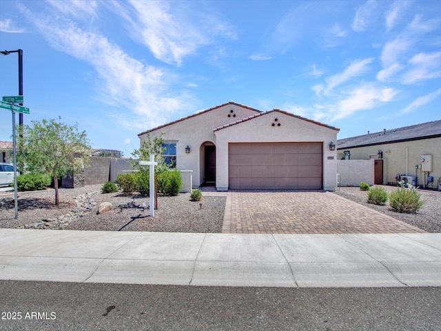 15817 S 177th Dr, Goodyear, AZ 85338 - mediterranean / spanish home with decorative driveway, a garage, stucco siding, and a tiled roof