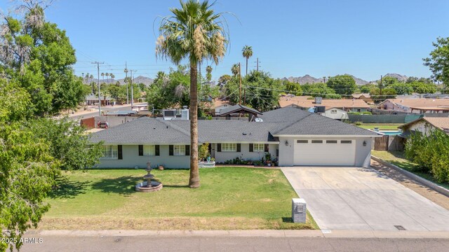 1208 E Tuckey Ln, Phoenix, AZ 85014 - ranch-style house featuring an attached garage, concrete driveway, a shingled roof, and a residential view