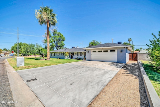 1208 E Tuckey Ln, Phoenix, AZ 85014 - ranch-style house with driveway and an attached garage