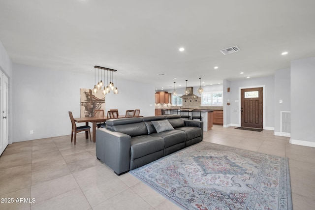 1208 E Tuckey Ln, Phoenix, AZ 85014 - living area with recessed lighting, light tile patterned floors, and a chandelier