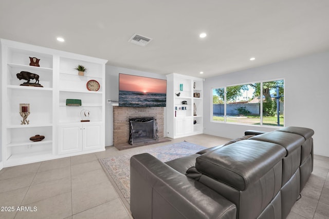1208 E Tuckey Ln, Phoenix, AZ 85014 - tiled living room featuring recessed lighting, a fireplace, and built in shelves