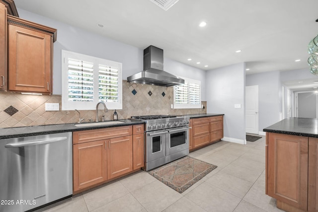 1208 E Tuckey Ln, Phoenix, AZ 85014 - kitchen featuring appliances with stainless steel finishes, wall chimney range hood, backsplash, recessed lighting, and brown cabinets