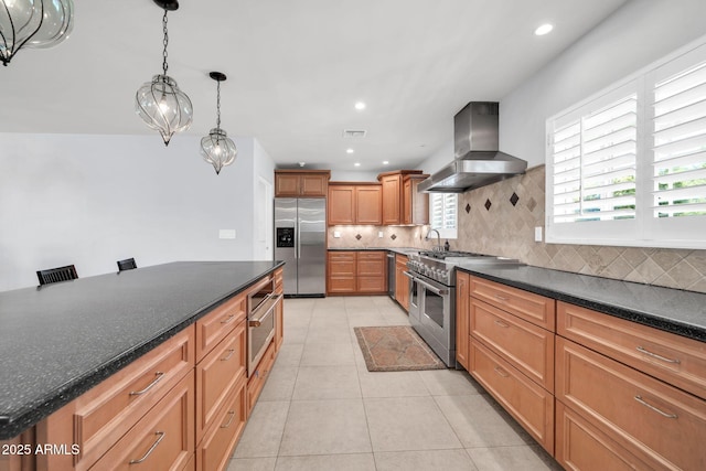 1208 E Tuckey Ln, Phoenix, AZ 85014 - kitchen with stainless steel appliances, exhaust hood, tasteful backsplash, light tile patterned floors, and recessed lighting
