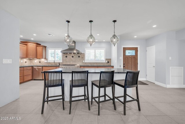 1208 E Tuckey Ln, Phoenix, AZ 85014 - kitchen with wall chimney range hood, dishwasher, tasteful backsplash, recessed lighting, and a breakfast bar area