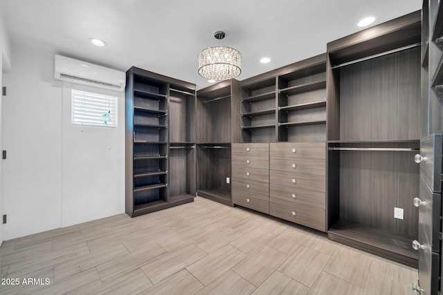1208 E Tuckey Ln, Phoenix, AZ 85014 - spacious closet featuring a wall unit AC and a chandelier