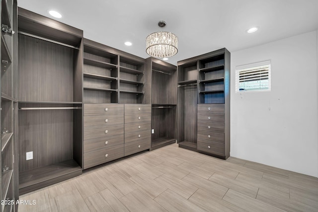 1208 E Tuckey Ln, Phoenix, AZ 85014 - spacious closet featuring a chandelier
