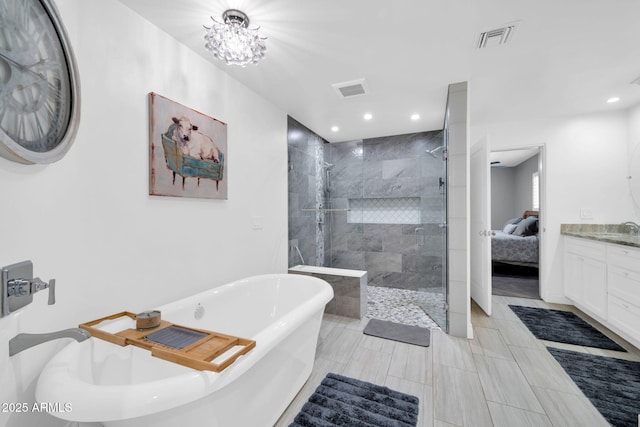 1208 E Tuckey Ln, Phoenix, AZ 85014 - bathroom featuring a soaking tub, a stall shower, ensuite bath, vanity, and recessed lighting